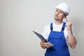 Repair man holding paper clipboard document Royalty Free Stock Photo