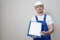 Repair man holding paper clipboard document Royalty Free Stock Photo