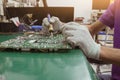 The repair man using digital multimeter measurement on circuit of PCB board. Royalty Free Stock Photo