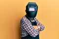 Repair man wearing professional welding mask over head covering face for protection Royalty Free Stock Photo