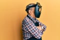 Repair man wearing professional welding mask over head covering face for protection Royalty Free Stock Photo