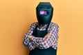 Repair man wearing professional welding mask over head covering face for protection Royalty Free Stock Photo