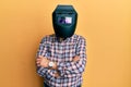 Repair man wearing professional welding mask over head covering face for protection Royalty Free Stock Photo