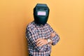Repair man wearing professional welding mask over head covering face for protection Royalty Free Stock Photo