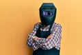 Repair man wearing professional welding mask over head covering face for protection Royalty Free Stock Photo