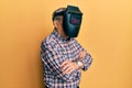 Repair man wearing professional welding mask over head covering face for protection