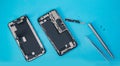 Repair modern mobile phone, master disassembles case to replace broken screen or replacement battery degradation top Royalty Free Stock Photo