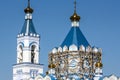 The repair of the Orthodox Church scaffolding on the tower, a blue roof and blue sky Royalty Free Stock Photo