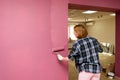 Repair. Painting walls with paint-roller Royalty Free Stock Photo