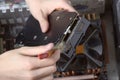 Repair of PC cleaning of video card from dust using brush Royalty Free Stock Photo