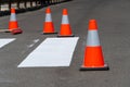 Repair a pedestrian crossing on an asphalt surface on a city street. Work on road. Construction cone