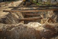 Repair of a pipe, an excavator on the road Royalty Free Stock Photo