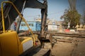 Repair of a pipe, an excavator on the road Royalty Free Stock Photo