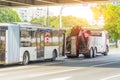 Repair and recovery vehicle evacuation, rear view towing a broken city bus Royalty Free Stock Photo