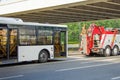 Repair and recovery vehicle evacuation, towing a broken city bus