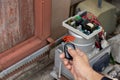 Technician man hand holding the  remote control, testing and checking the function of automatic gate. Royalty Free Stock Photo