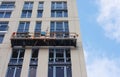 Repair and restoration of a facade of a high building.