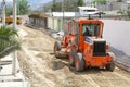 Repair of roads along Museo Solar, San Antonio, Mitad del Mundo, Quito. Transport works, a tractor, heavy machinery. 04.09.2018