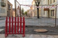 Repair of roads. Laying new asphalt. Protective barrier in front of a hole in the road Royalty Free Stock Photo