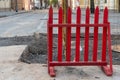 Repair of roads. Laying new asphalt. Protective barrier in front of a hole in the road Royalty Free Stock Photo