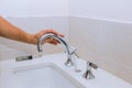 Repair service, assemble new faucet lies on the ceramic sink Royalty Free Stock Photo