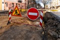 repair of sidewalks and roads in the city. A section of the street closed from traffic. A road sign signifying a dangerous zone