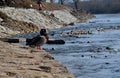 Repair of the slope above the river, the river banks are strengthened by a bunch of stonemasons where the embankment is paved with