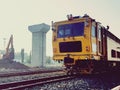 Repair train on the railway in modern train structure background Royalty Free Stock Photo