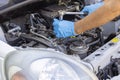 Repair of vehicle engine. Car spark plug and ignition coil change or replacement. Royalty Free Stock Photo