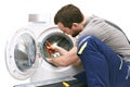 Repair washing machine by a service technician at customer`s home // insulated on white background