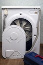 Repair of washing machines, repair of large household appliances. The back of the washing machine is removed