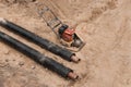 Repair of the water line of the heating main pipe in the ground trench pipeline at the construction site work industry, soil