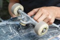 Repair of the wheel pair of skateboarding Royalty Free Stock Photo