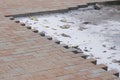 Repair work on city street paving brick with self-locking blocks