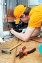 Repair work on fridge appliance