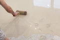 Repair work. Pouring floors in the room. Fill screed floor repair and furnish. Worker align cement with roller Royalty Free Stock Photo