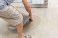 Repair work. Pouring floors in the room. Fill screed floor repair and furnish. Worker pouring concrete on the floor