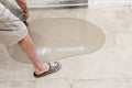Repair work. Pouring floors in the room. Fill screed floor repair and furnish. Worker pouring concrete on the floor Royalty Free Stock Photo