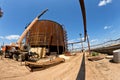 Repair work on replacement of lower belts of old rusty tank for Royalty Free Stock Photo