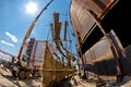 Repair work on replacement of lower belts of old rusty tank for Royalty Free Stock Photo