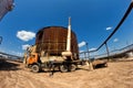 Repair work on replacement of lower belts of old rusty tank for Royalty Free Stock Photo