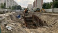 Repair work on sewer pipe reconstruction. Open pit with pipes Royalty Free Stock Photo