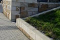 Repaired renovated sandstone walls near the cemetery. stairs and railings of the wall made of new stone which weatheres quickly bu Royalty Free Stock Photo