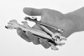 Repairer or mechanic hand holds spanner instrument. Spanner equipment made of metal. Service and engineering concept