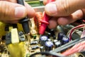 REPAIRING ELECTRONICS WITH TEST EQUIPMENT IN SERVICE CENTER BY ENGINEER Royalty Free Stock Photo
