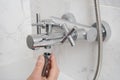 Repairing a faucet in a bathroom Royalty Free Stock Photo