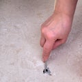 Repairing floor tiles with a hole, cementing broken tiles