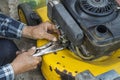 repairing lawn mower engine in close up Royalty Free Stock Photo