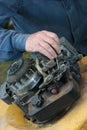 Repairing lawn mower engine Royalty Free Stock Photo