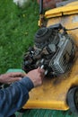 Repairing lawn mower engine Royalty Free Stock Photo